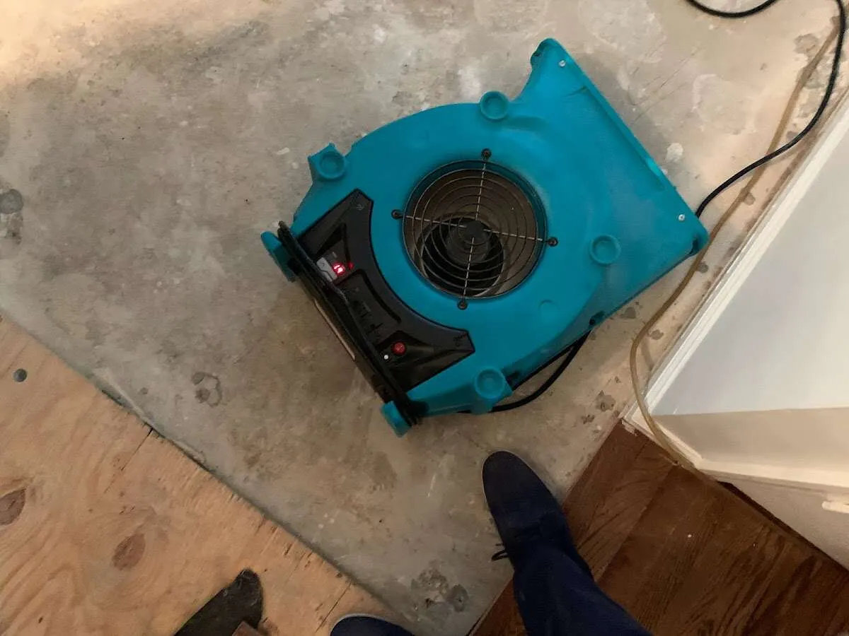 Air mover drying subfloor during Commercial Water Damage Restoration in Ossining